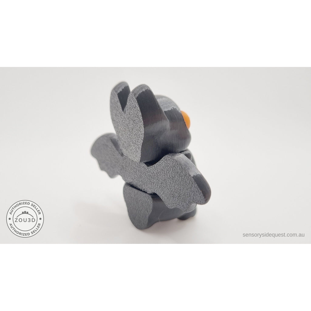 Tiny Bat rear view showing wing structure and body segments — orange eye variant