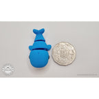 Baby Blue Whale articulated fidget toy next to Australian 50c coin for size reference — overhead flat-lay, own photo by Sensory Sidequest