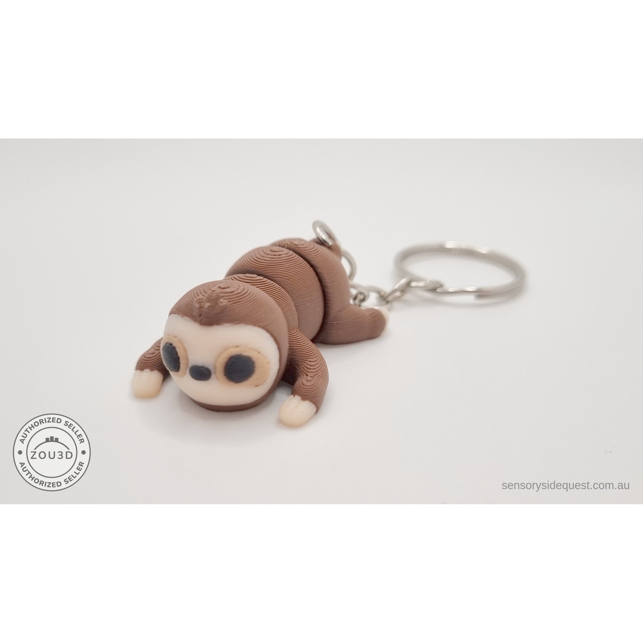 Baby Sloth keychain variant — 3/4 front view showing face and key ring, own photo by Sensory Sidequest
