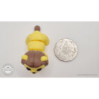 Yellow and brown Baby Lion 3D printed articulated fidget toy shown with Australian 50 cent coin for scale — Sensory Sidequest Australia