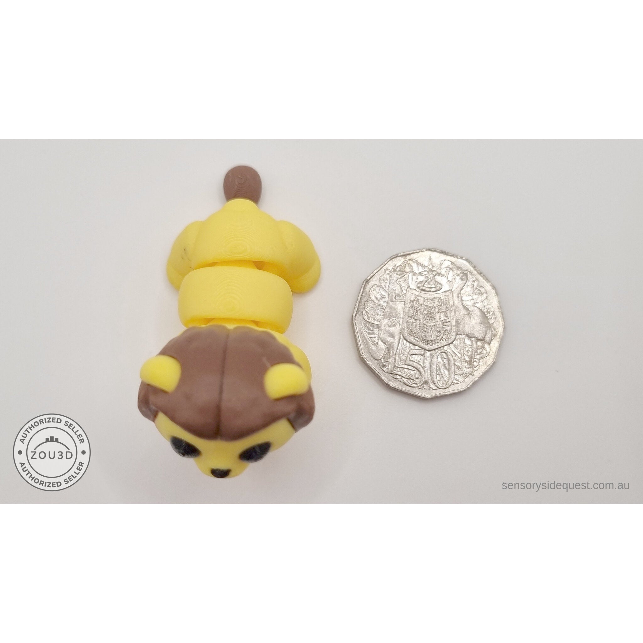 Yellow and brown Baby Lion 3D printed articulated fidget toy shown with Australian 50 cent coin for scale — Sensory Sidequest Australia