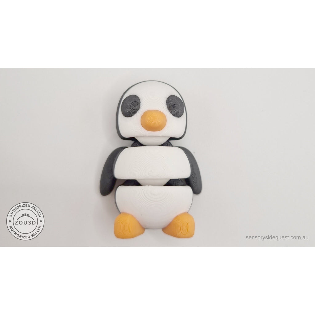 Penguin articulated fidget toy compressed and folded showing articulation joint detail, orange foot visible at side — 3D printed articulated fidget toy by Sensory Sidequest