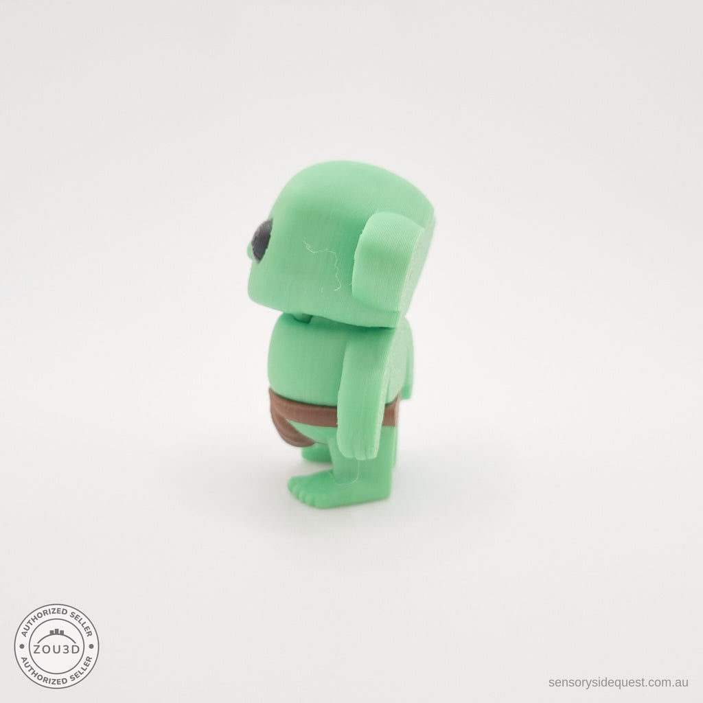 Green Tiny Goblin 3D printed toy — back/side angle showing ear detail