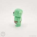 Green Tiny Goblin 3D printed toy — back/side angle showing ear detail