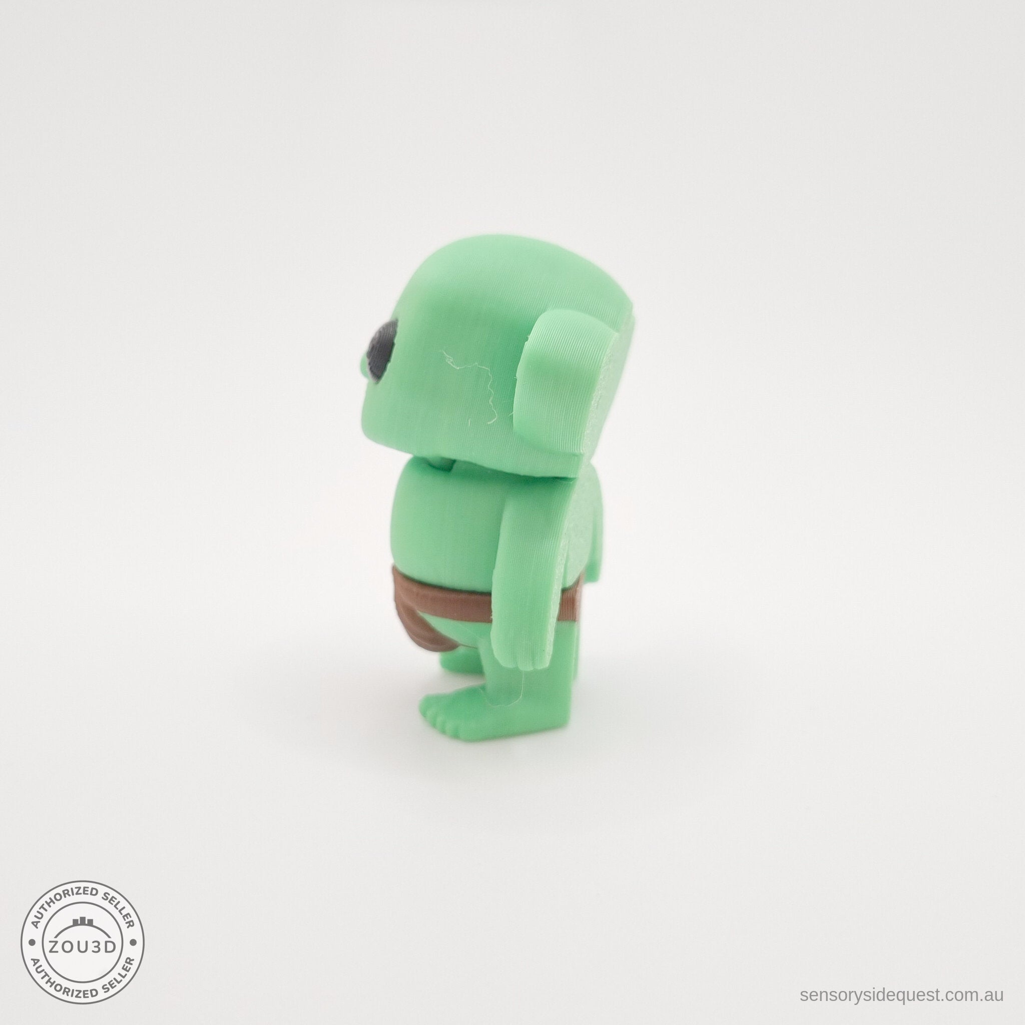 Green Tiny Goblin 3D printed toy — back/side angle showing ear detail