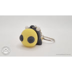 Baby Bee keychain variant — front three-quarter view with ring and chain hardware