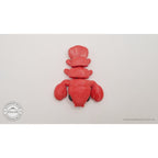 Baby Lobster articulated fidget toy in red silk — overhead flat-lay showing full body, claws and tail fan from directly above