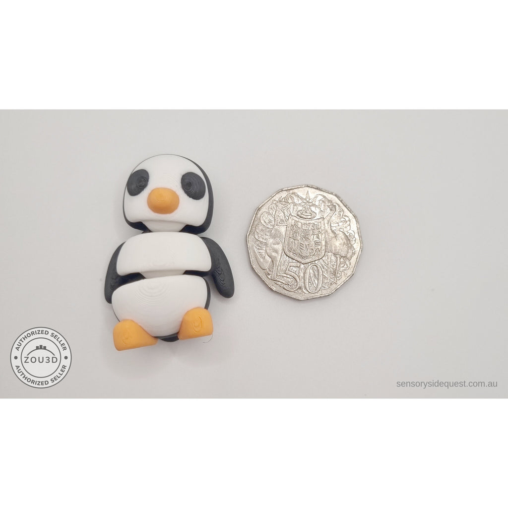 Penguin articulated fidget toy size reference next to Australian 50 cent coin, showing compact palm-sized scale — 3D printed articulated fidget toy by Sensory Sidequest
