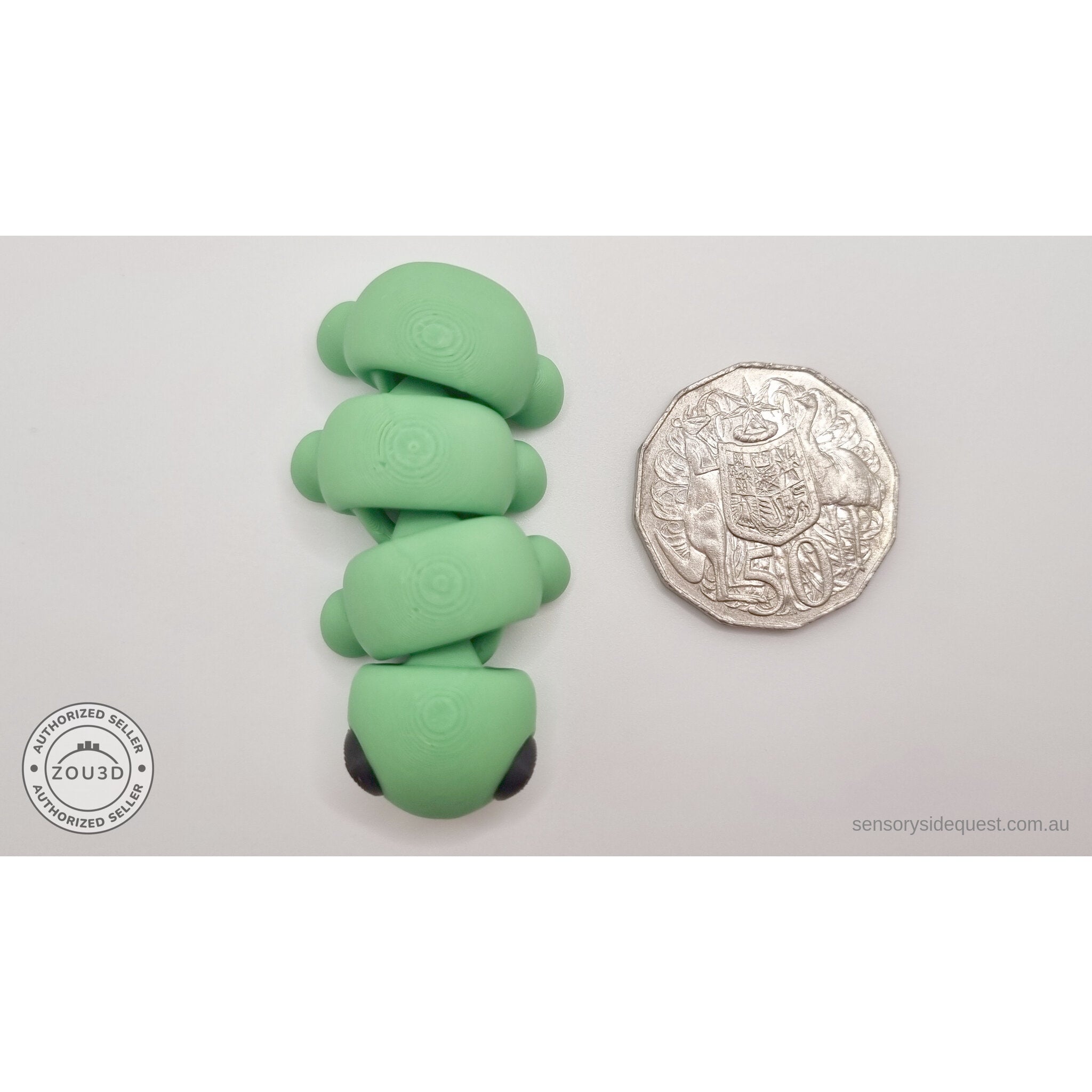 Green Baby Caterpillar 3D printed articulated fidget toy shown with Australian 50 cent coin for scale — Sensory Sidequest Australia