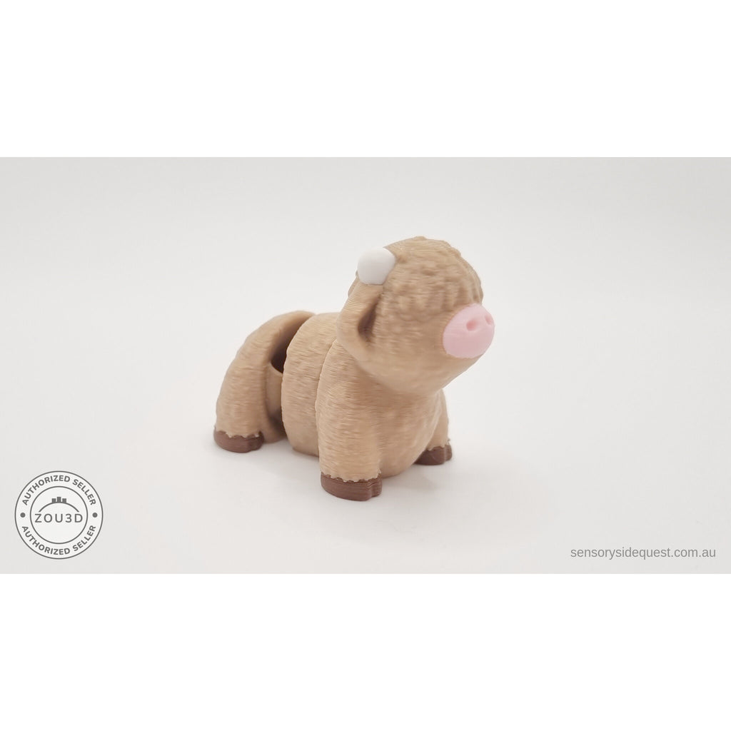 Baby Highland Cow 3D printed fidget toy shown beside an Australian 50 cent coin to show size — Sensory Sidequest