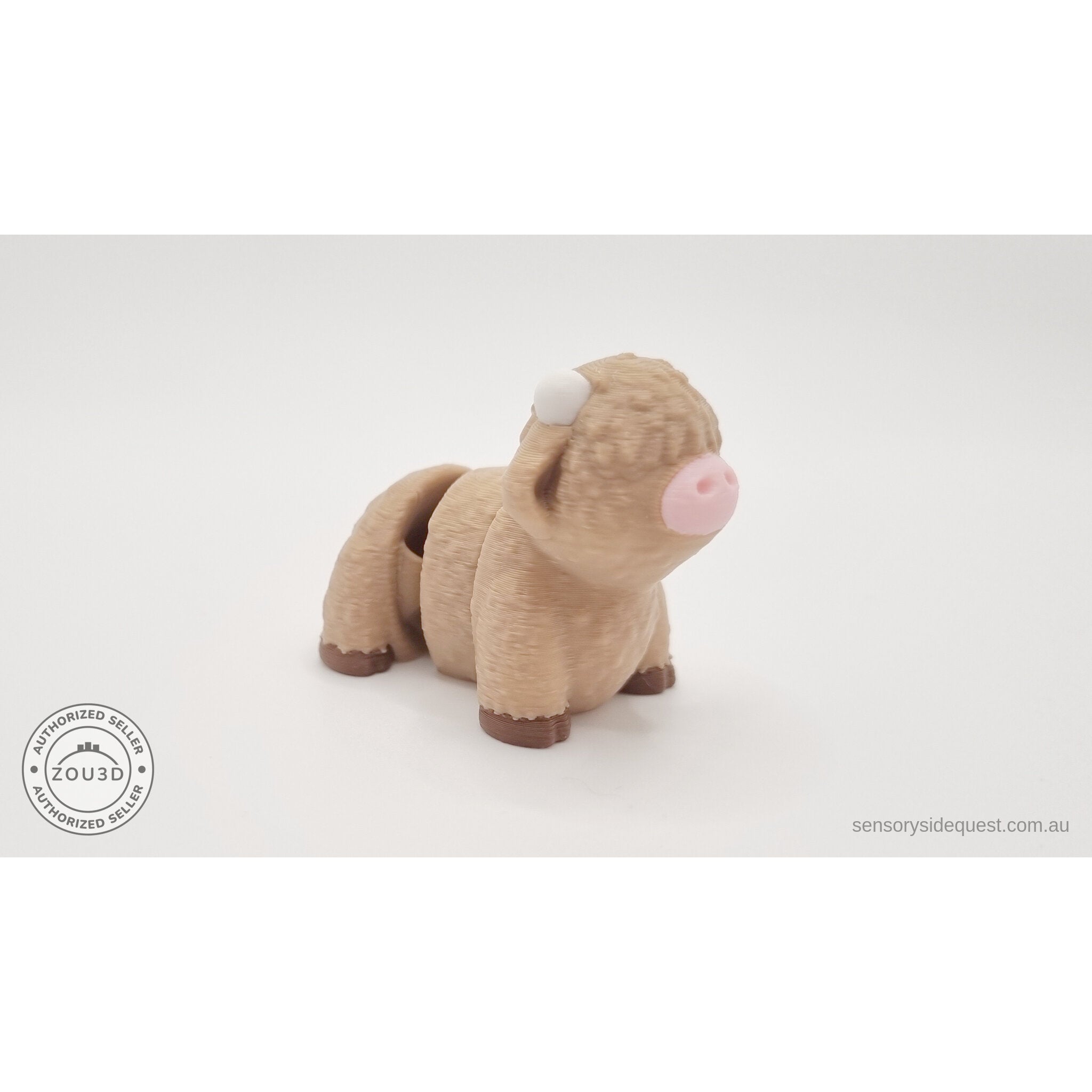 Baby Highland Cow 3D printed fidget toy shown beside an Australian 50 cent coin to show size — Sensory Sidequest