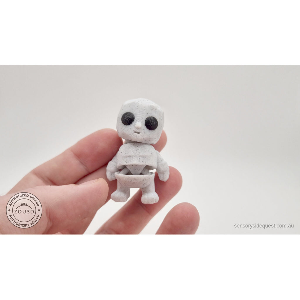 White granite Tiny Rock Golem held in hand showing articulated body by Sensory Sidequest
