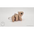 Baby Capybara smooth keychain — side view showing chain hardware along body