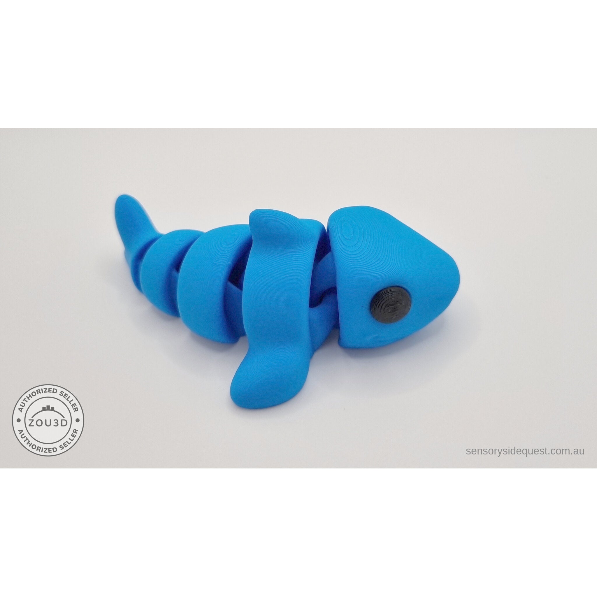 024-SHK Baby Shark in cyan matte, rear 3/4 view showing back segments and tail — 3D printed fidget toy by Sensory Sidequest