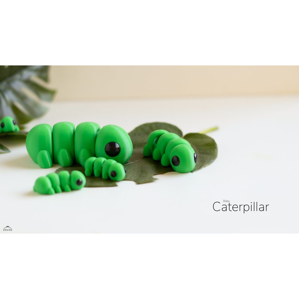 Baby Caterpillar 3D printed articulated fidget toy — Zou3D official lifestyle render showing three size variants on a leaf with foliage props, "Baby Caterpillar" branding