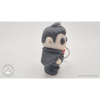 Tiny Dracula keychain articulated toy — 3/4 side view showing cape and ring, own photo by Sensory Sidequest