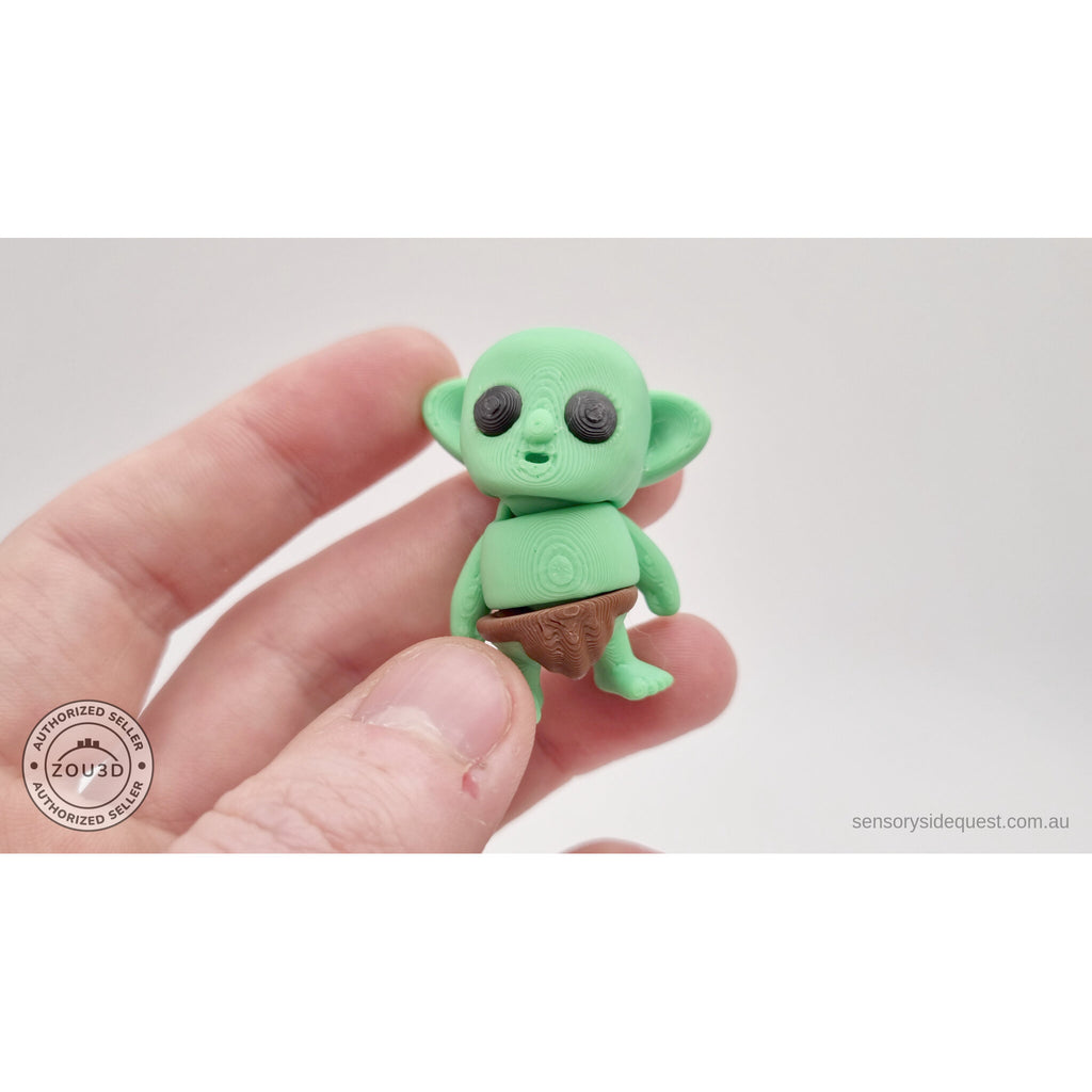 Tiny Goblin 3D printed toy held in hand — front view showing size