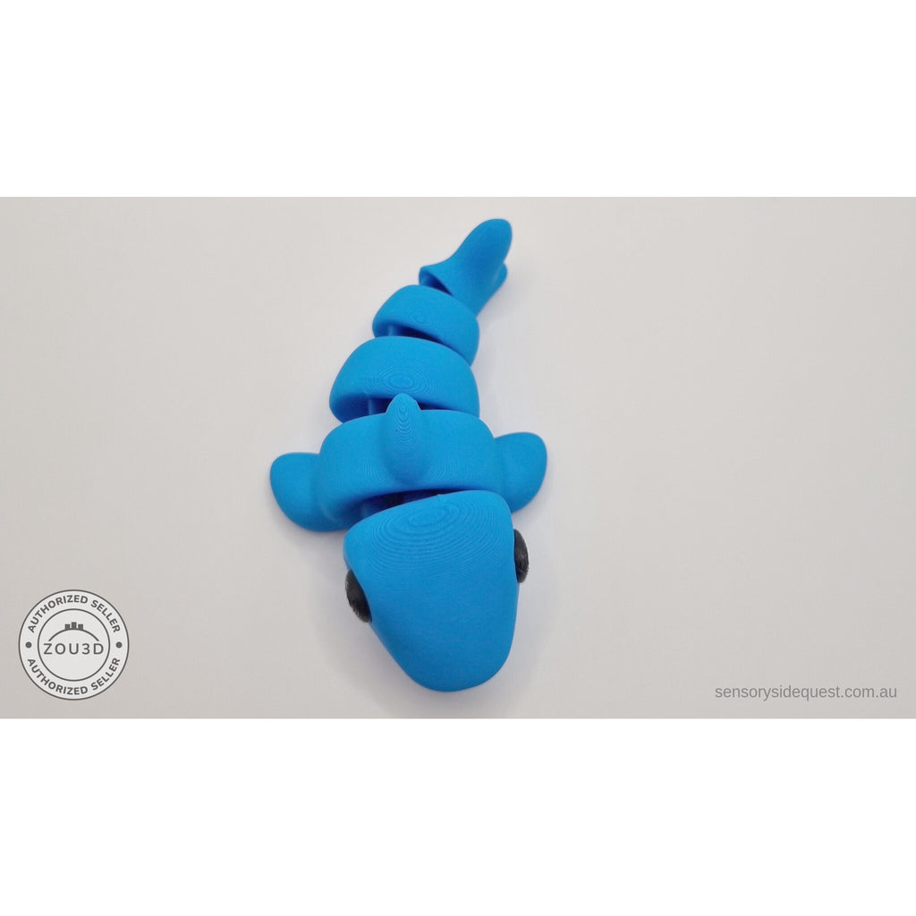 024-SHK Baby Shark in cyan matte, overhead top-down twisted view — 3D printed articulated fidget toy by Sensory Sidequest