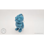 Tiny Robot 3D printed fidget toy keychain variant in teal — close 3/4 front view showing circular eyes and keychain ring — Sensory Sidequest
