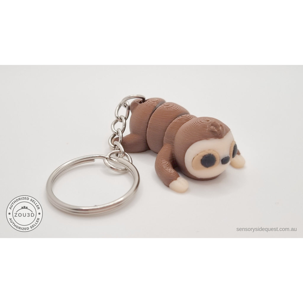 Baby Sloth keychain articulated toy — back view showing ring and chain, own photo by Sensory Sidequest
