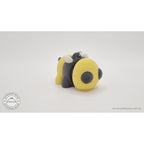 Baby Bee keychain — right three-quarter view with chain and ring hardware visible