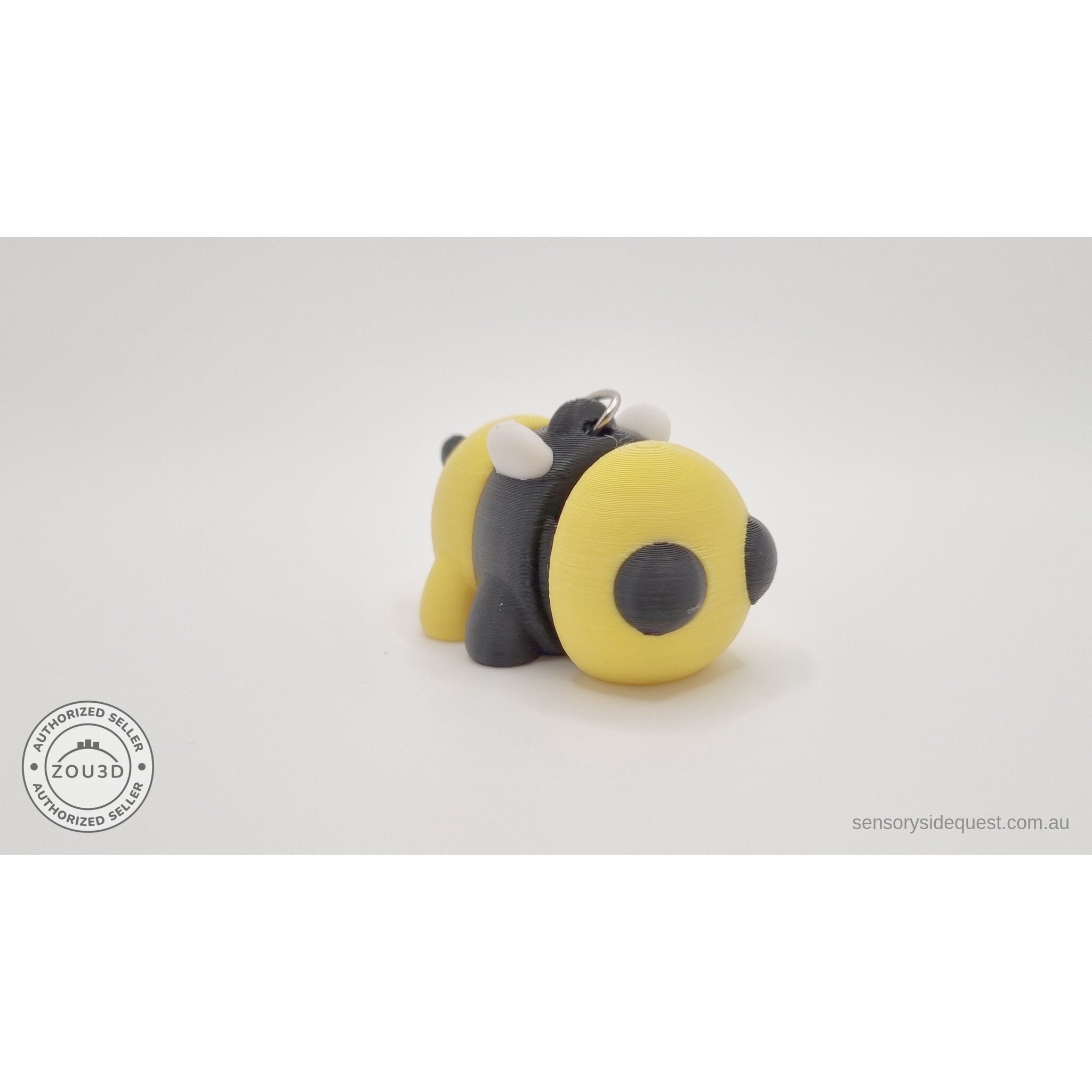 Baby Bee keychain — right three-quarter view with chain and ring hardware visible