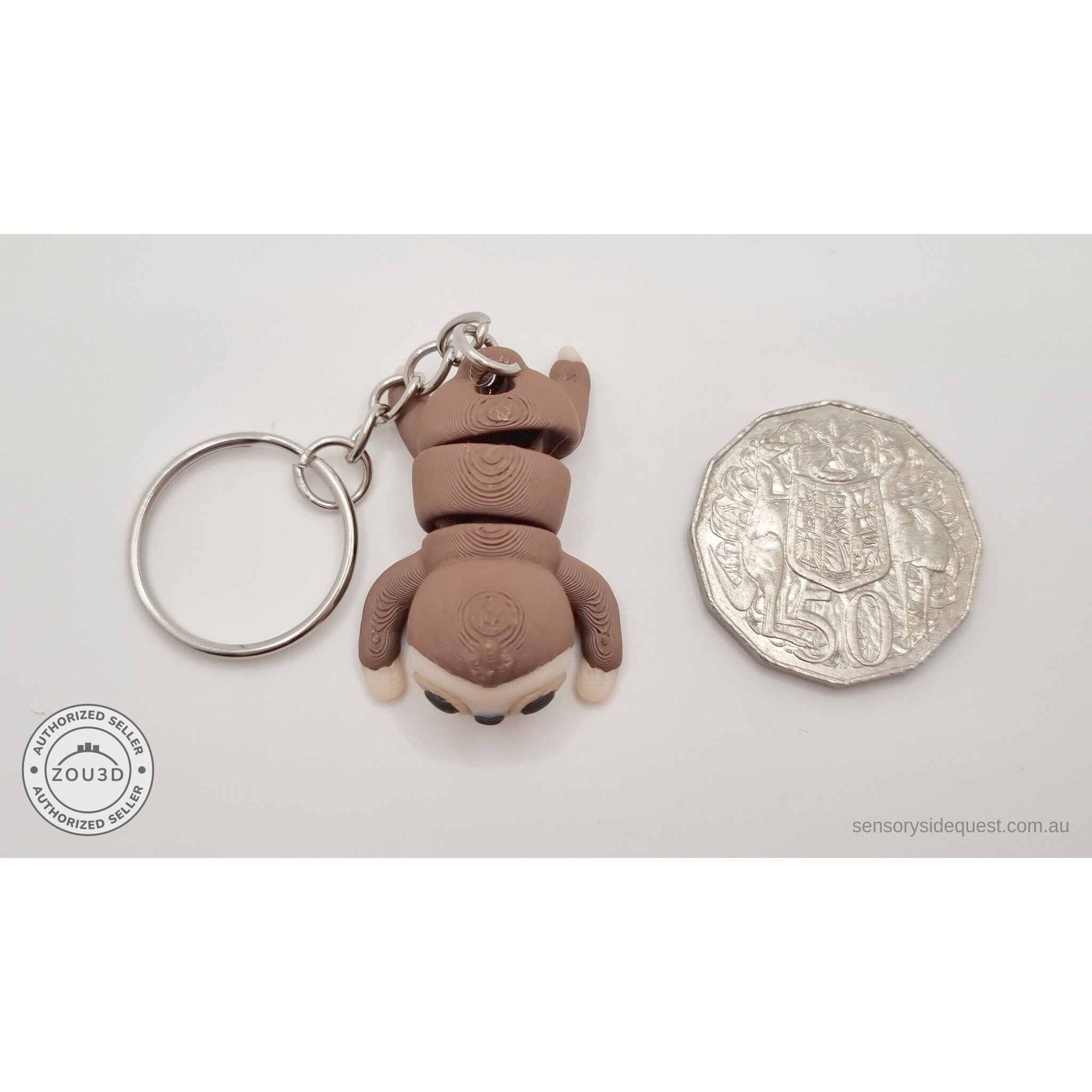 Baby Sloth keychain variant next to Australian 50c coin for size reference — own photo by Sensory Sidequest