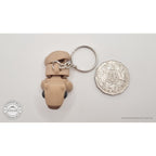 Baby Capybara smooth keychain beside Australian 50 cent coin — scale reference