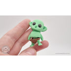 Tiny Goblin 3D printed toy held in hand — angled view showing articulated form