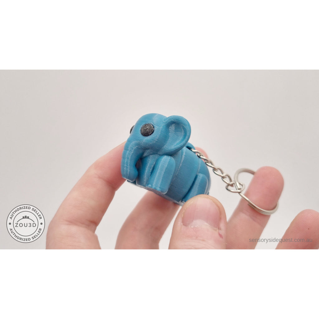 Blue Baby Elephant 3D printed keychain fidget toy held in hand — scale reference