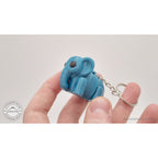 Blue Baby Elephant 3D printed keychain fidget toy held in hand — scale reference