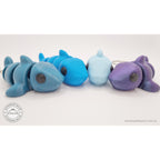 024-SHK Baby Shark group shot — four colour variants lined up side-by-side showing colour range (teal keychain, cyan, ice blue, purple metallic)