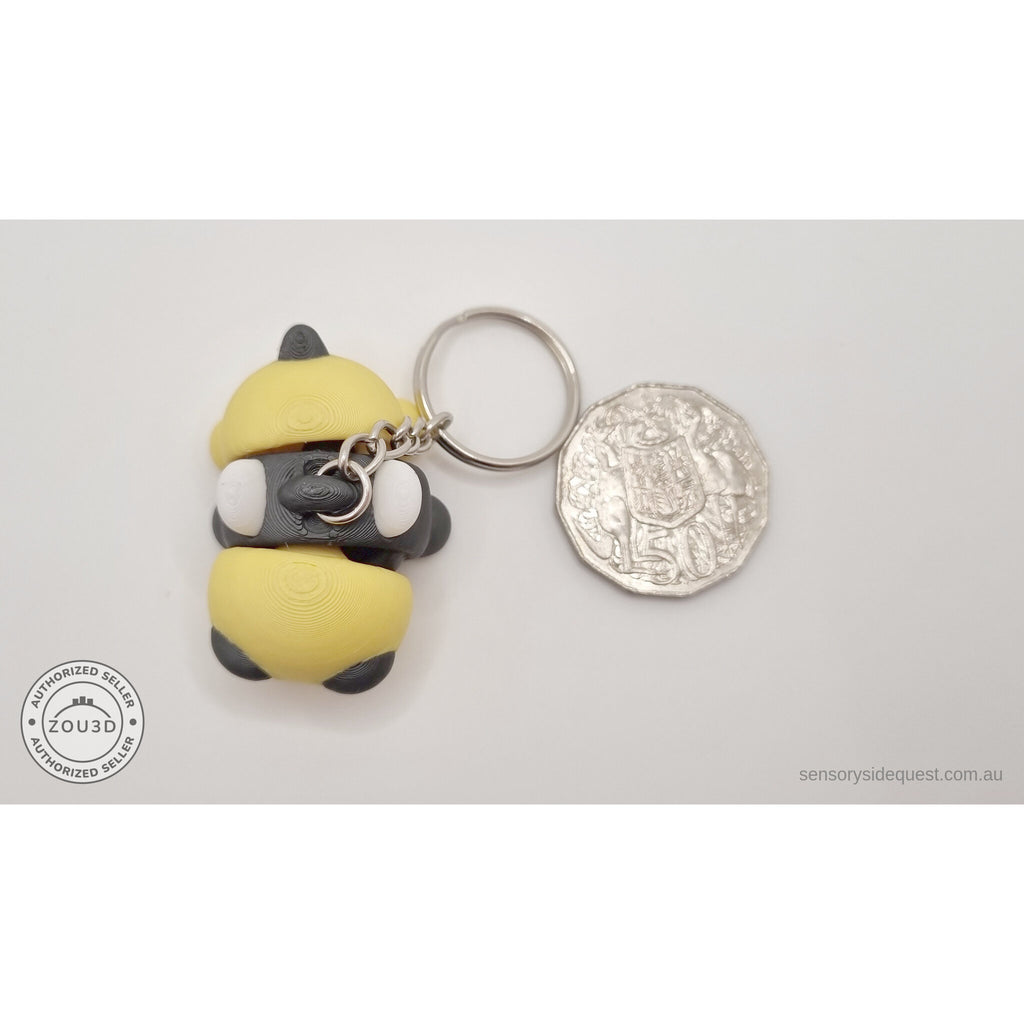 Baby Bee keychain beside Australian 50 cent coin — scale reference