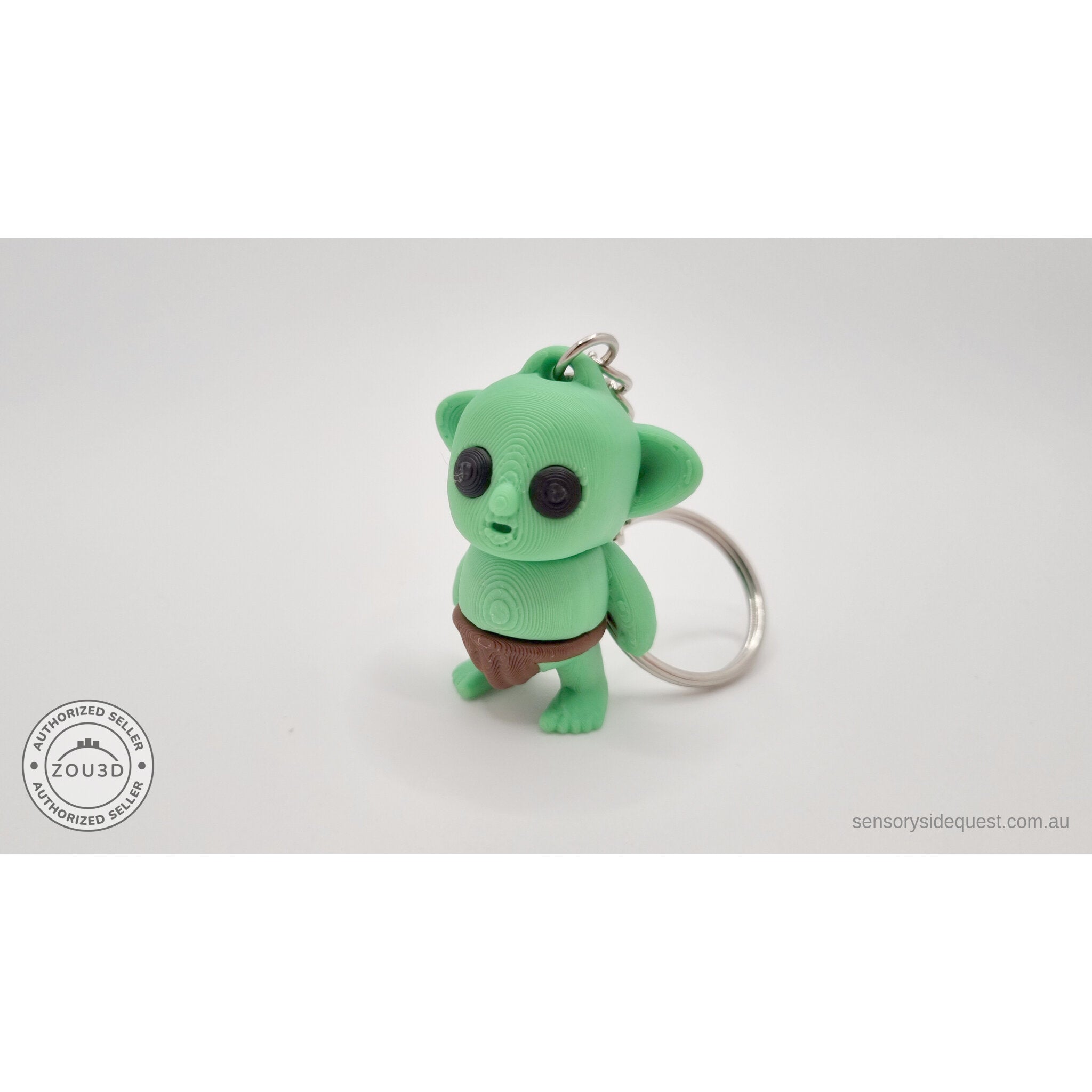 Tiny Goblin ZOU3D keychain — 3/4 front view with silver keyring