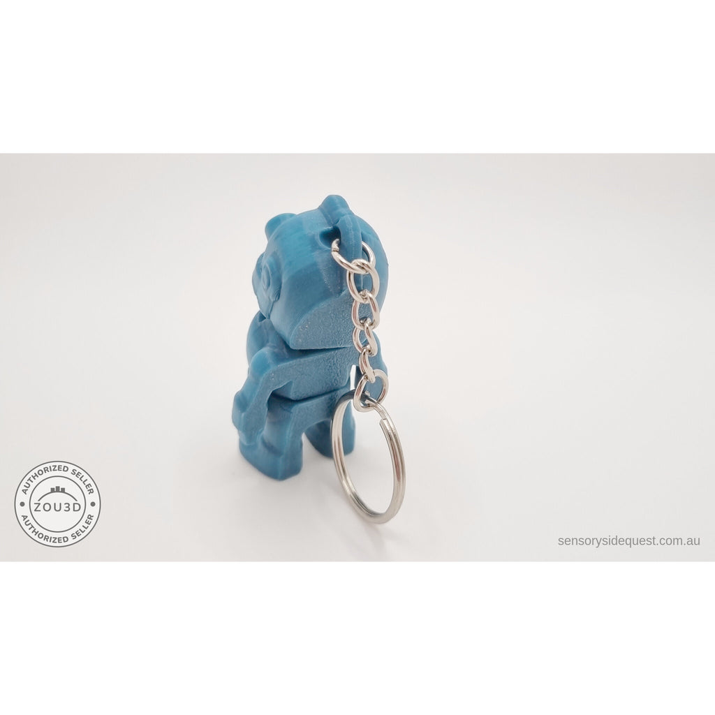 Tiny Robot 3D printed fidget toy keychain variant in teal — back view showing rear panel and chain hanging below — Sensory Sidequest