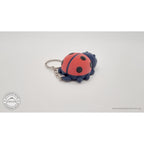 Baby Ladybug keychain — angled rear view showing spotted shell and keychain hardware