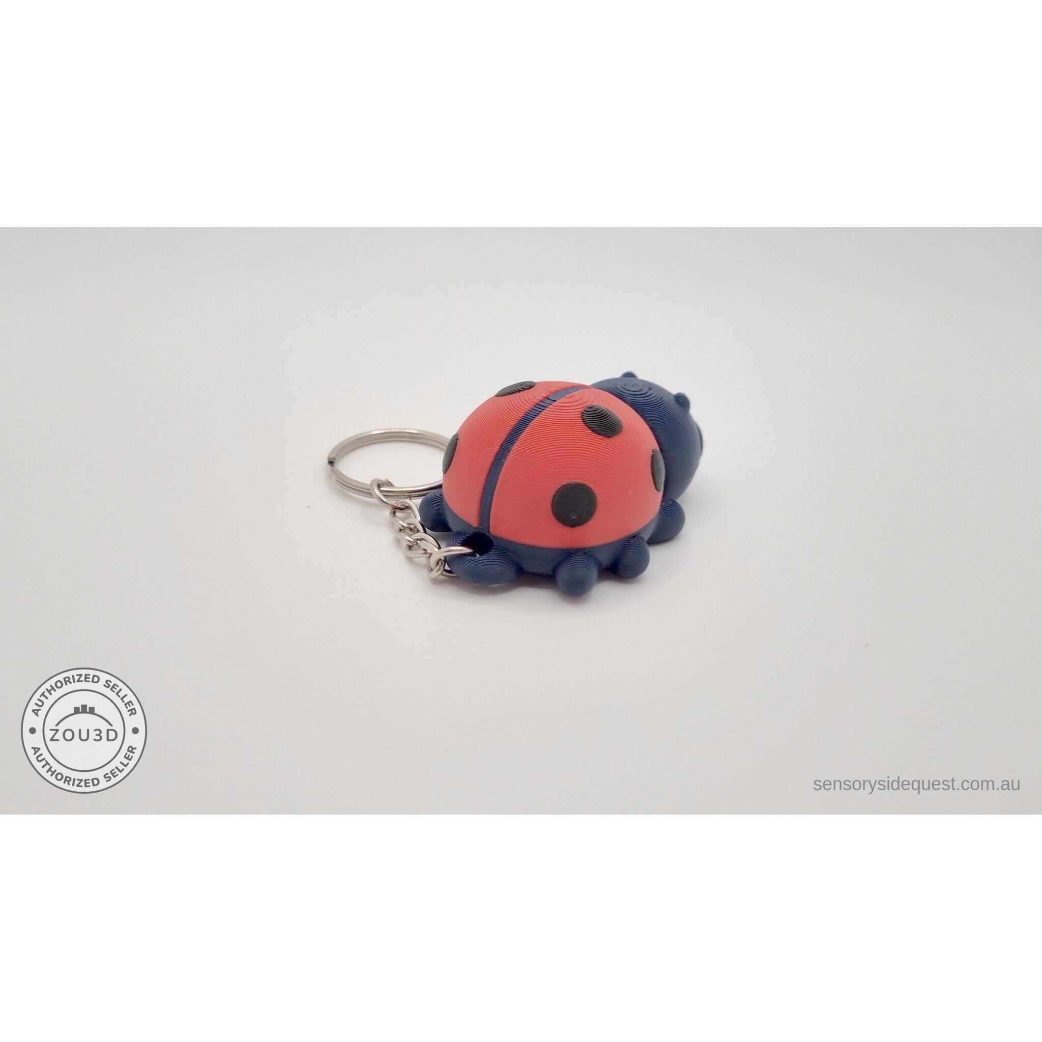 Baby Ladybug keychain — angled rear view showing spotted shell and keychain hardware