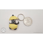 Baby Bee keychain — alternate scale view beside Australian 50 cent coin