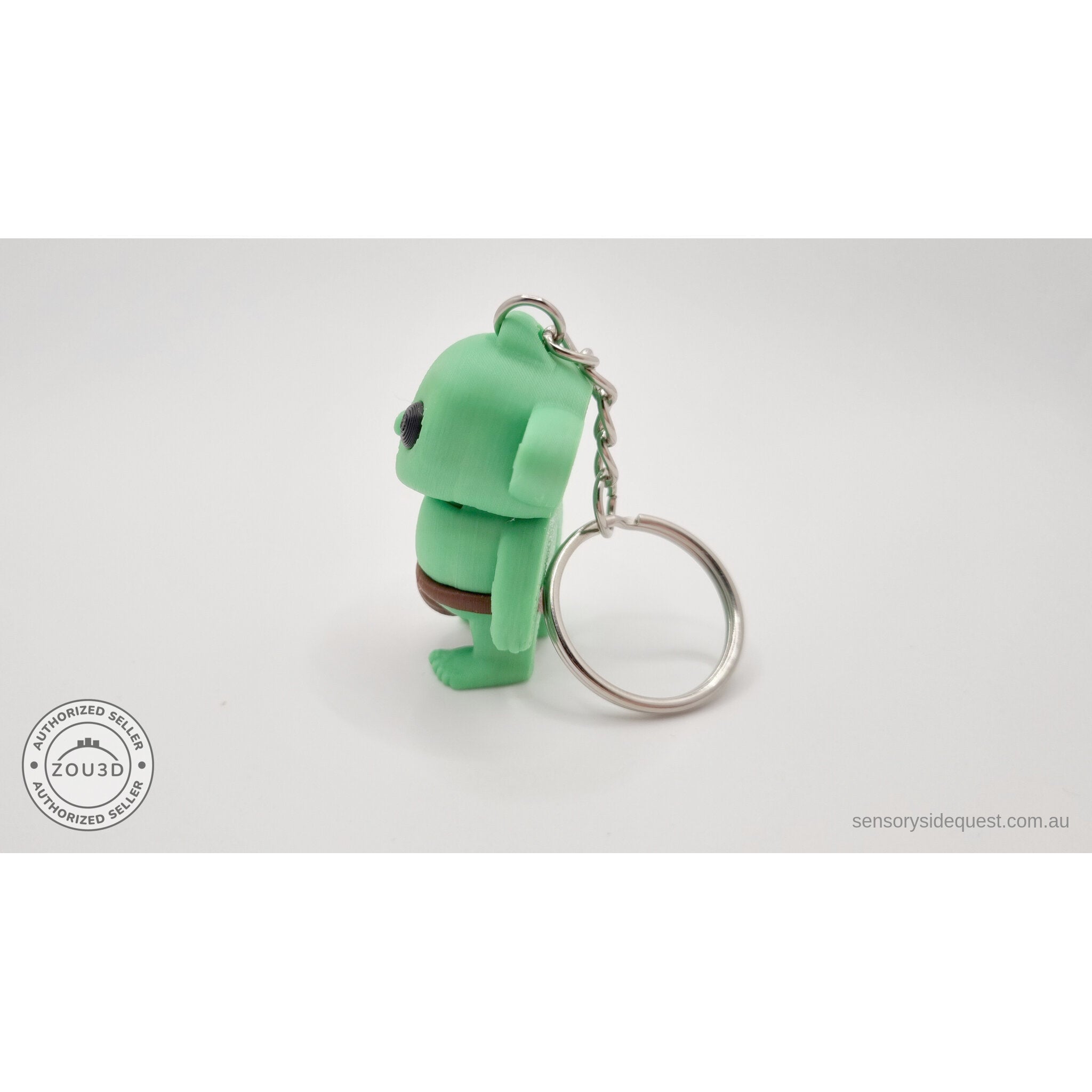 Tiny Goblin ZOU3D keychain — side-back view showing chain attachment