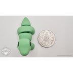 Green Baby Brontosaurus 3D printed articulated fidget toy shown with Australian 50 cent coin for scale — overhead view — Sensory Sidequest Australia