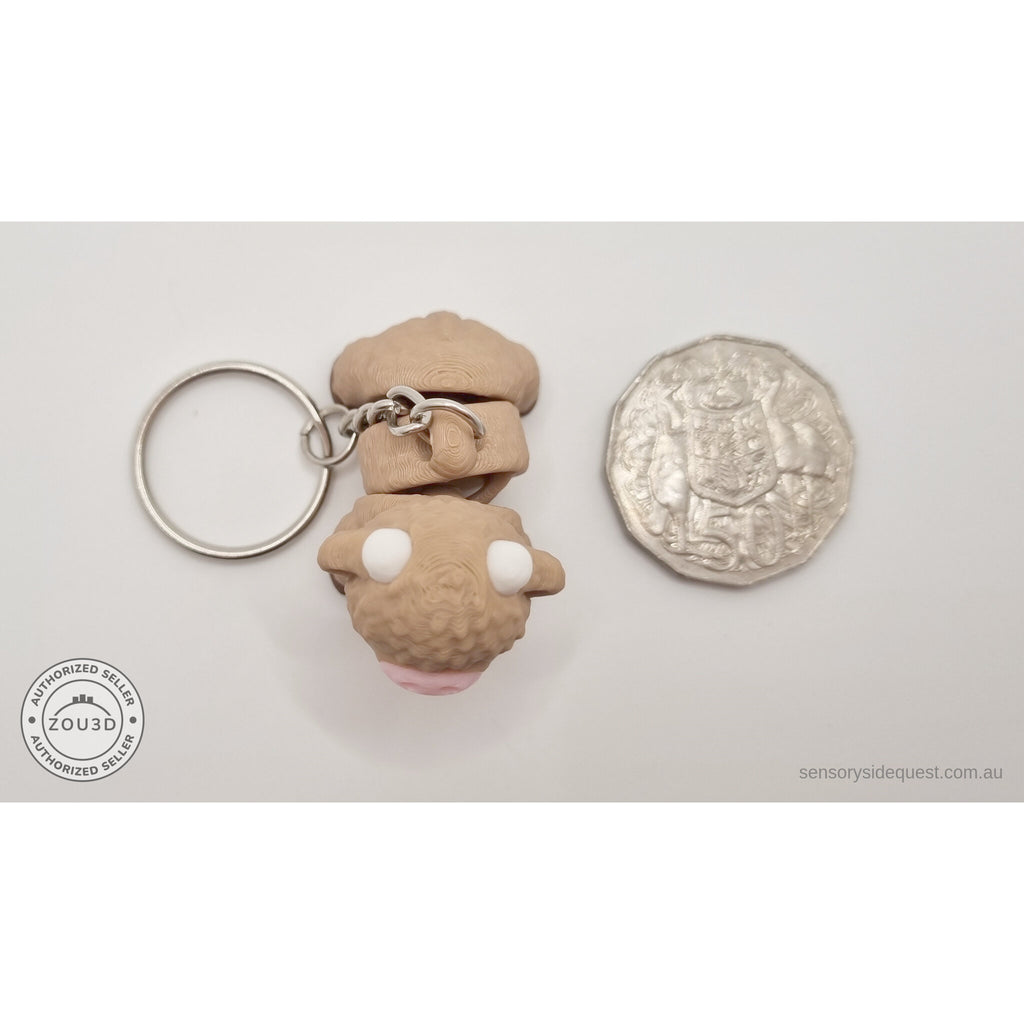Baby Highland Cow keychain and standard variant 3D printed articulated fidget toys shown side by side — Sensory Sidequest Australia