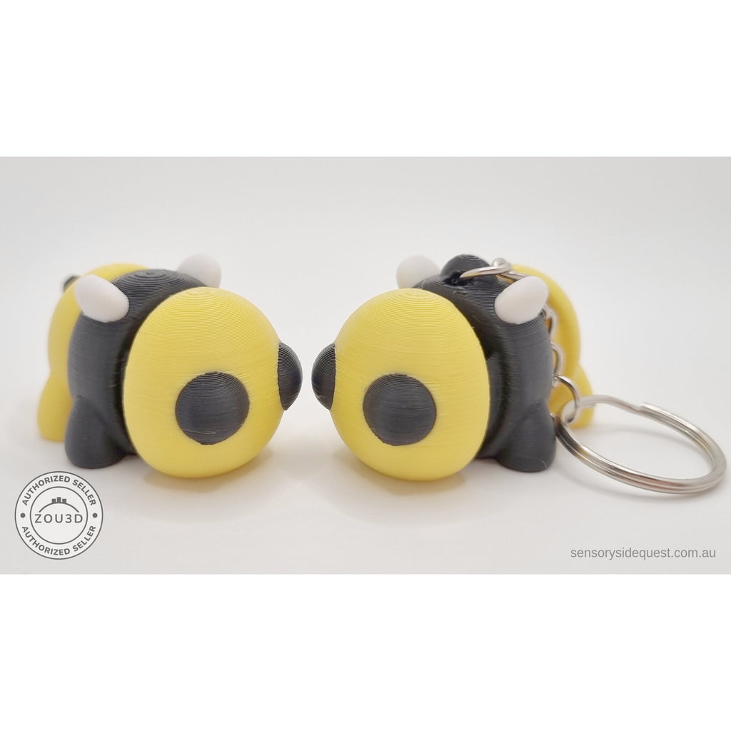 Baby Bee standalone and keychain variant side by side — group shot showing both options