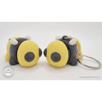 Baby Bee standalone and keychain variant side by side — group shot showing both options