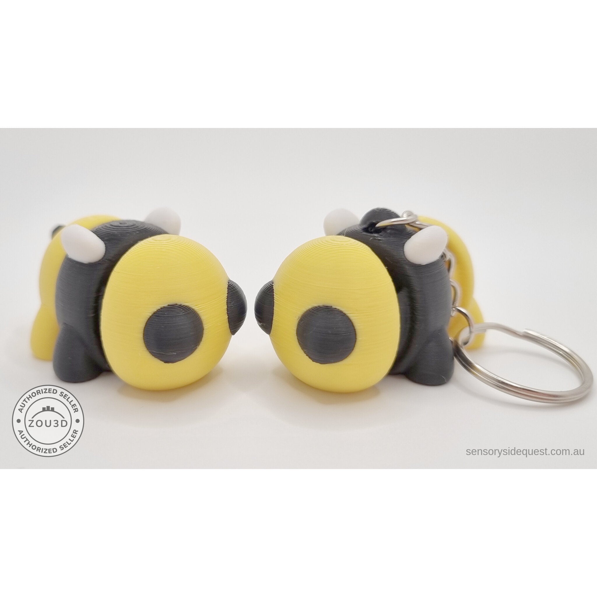 Baby Bee standalone and keychain variant side by side — group shot showing both options