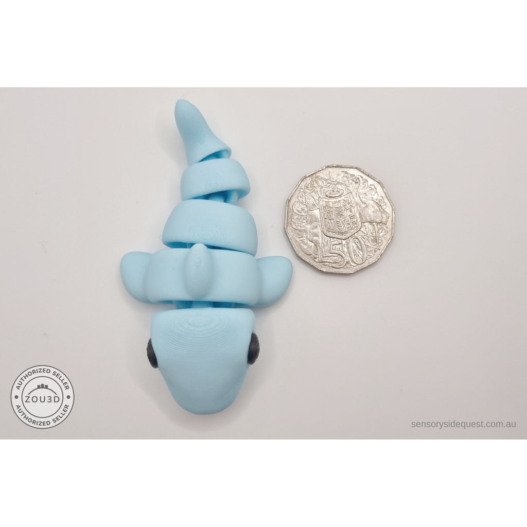 024-SHK Baby Shark in ice blue matte, overhead scale reference beside Australian 50 cent coin — 3D printed articulated fidget toy by Sensory Sidequest
