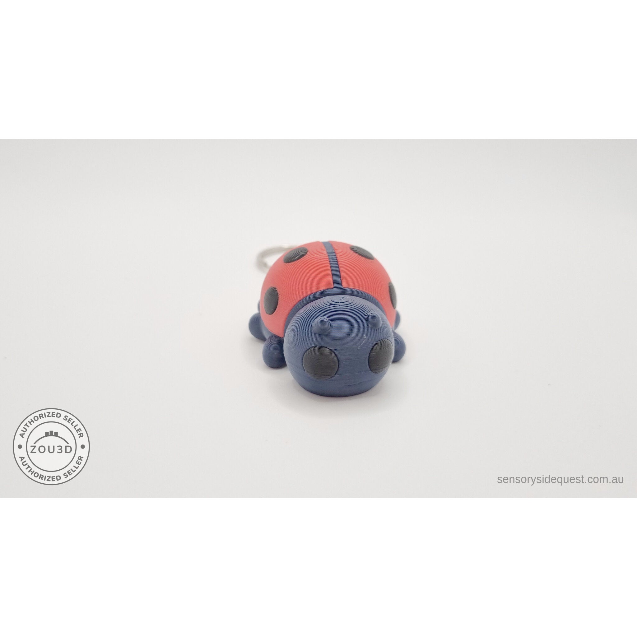 Baby Ladybug keychain — front-facing view showing expressive eyes and keyring