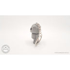 Grey Tiny Rock Golem keychain — back view showing articulation by Sensory Sidequest