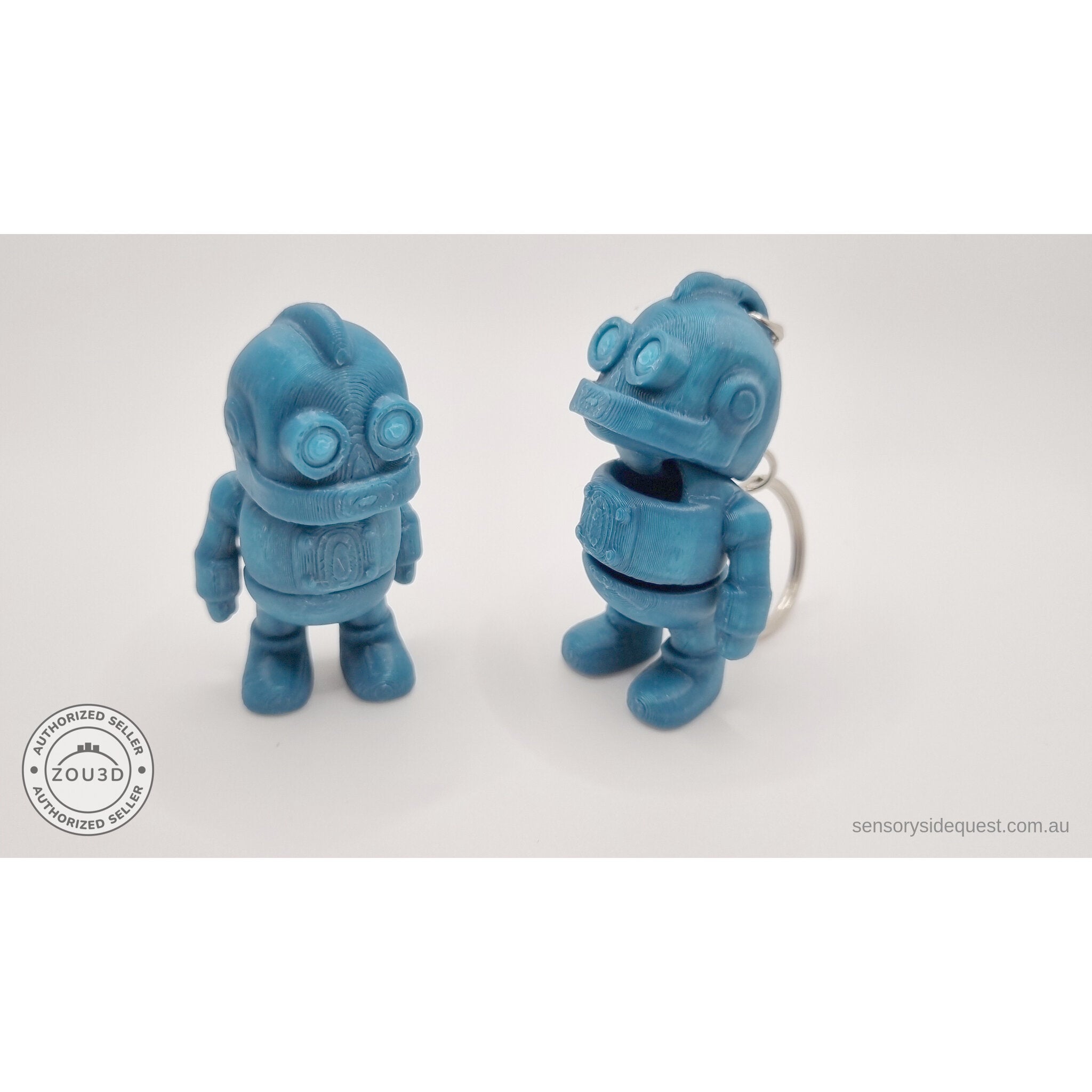 Tiny Robot 3D printed fidget toy — standalone (left) and keychain variant (right) angled in teal, showing both variants together — Sensory Sidequest