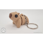 Baby Capybara fuzzy keychain — front three-quarter view showing textured surface and chain