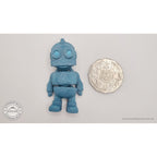 Tiny Robot 3D printed fidget toy in teal beside Australian 50 cent coin — scale reference showing compact palm-sized figure — Sensory Sidequest